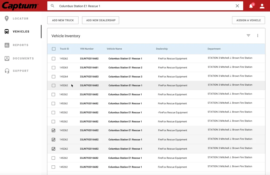 Vehicle inventory table with truck IDs, names, dealership, and department